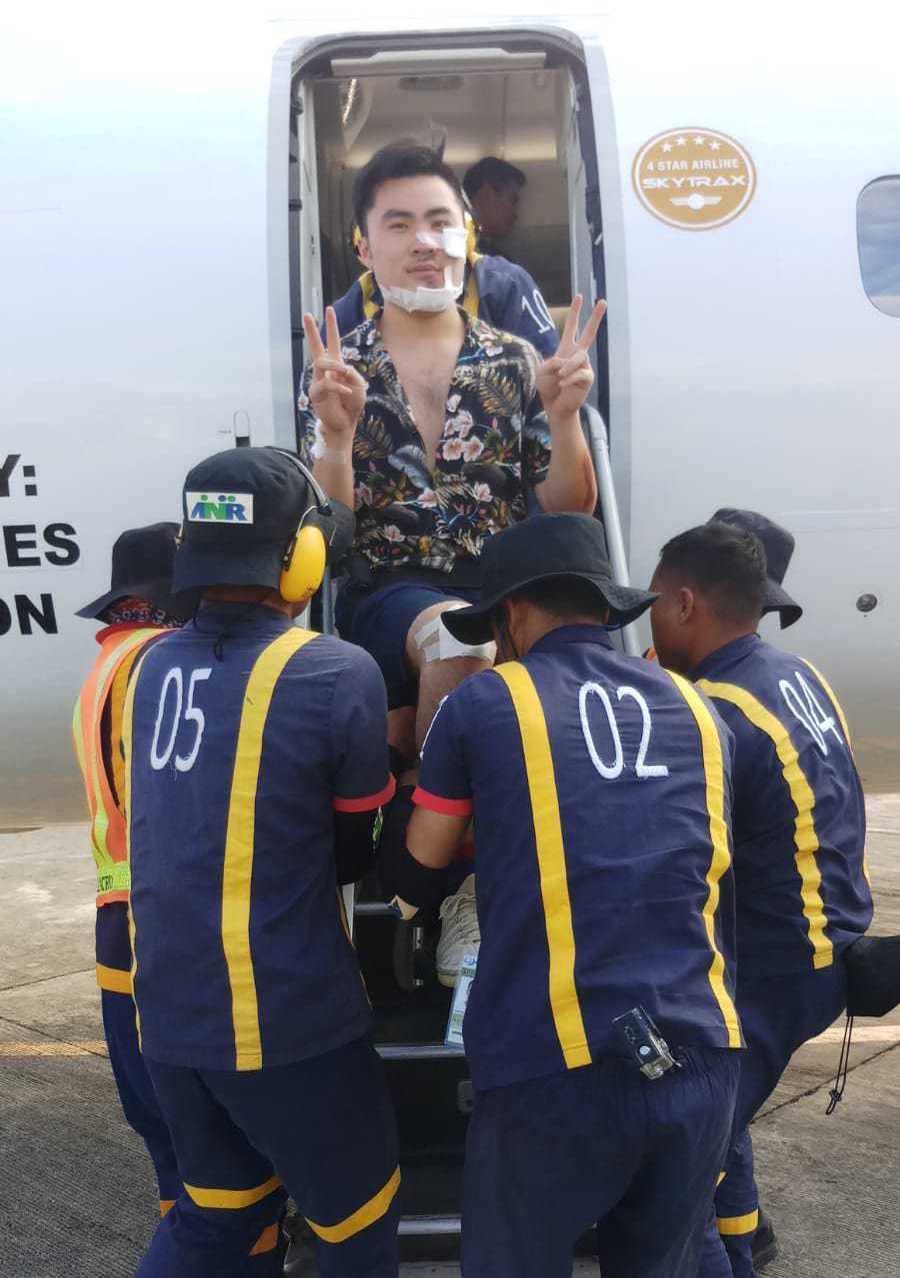 Chester being transported on a flight with his injuries